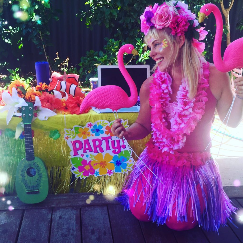Made with Repix (http://repix.it) A woman wearing a garment and holding flamingos.