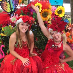 IMG_3209 Two women in red dresses and flowers.