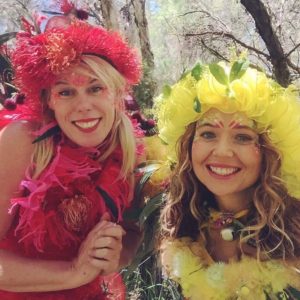 Square bush fairies photo Two women posing for a photo in a forest.