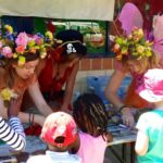 unspecifiedCA4LQGW6 A group of children dressed in fairy costumes at a table.