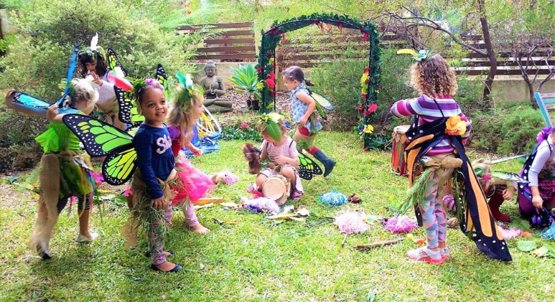A group of children dressed up in fairy costumes.