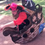 Pirate Obe and Pirate WIshes left A man dressed as a pirate sits on a wooden boat.